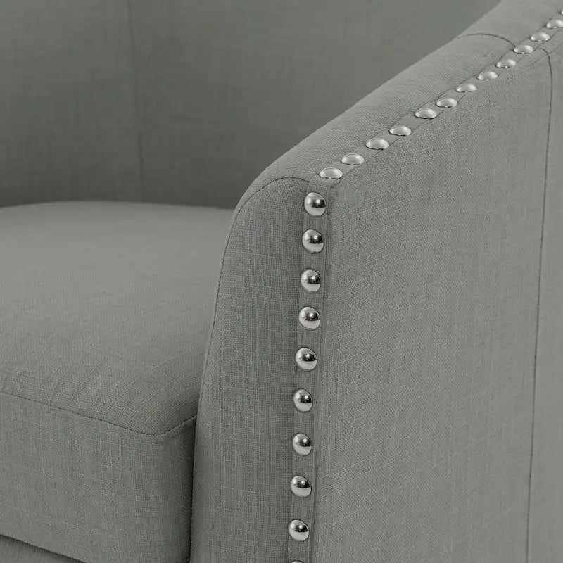 Fauteuil pivotant décoratif rembourré avec clous de tapissier